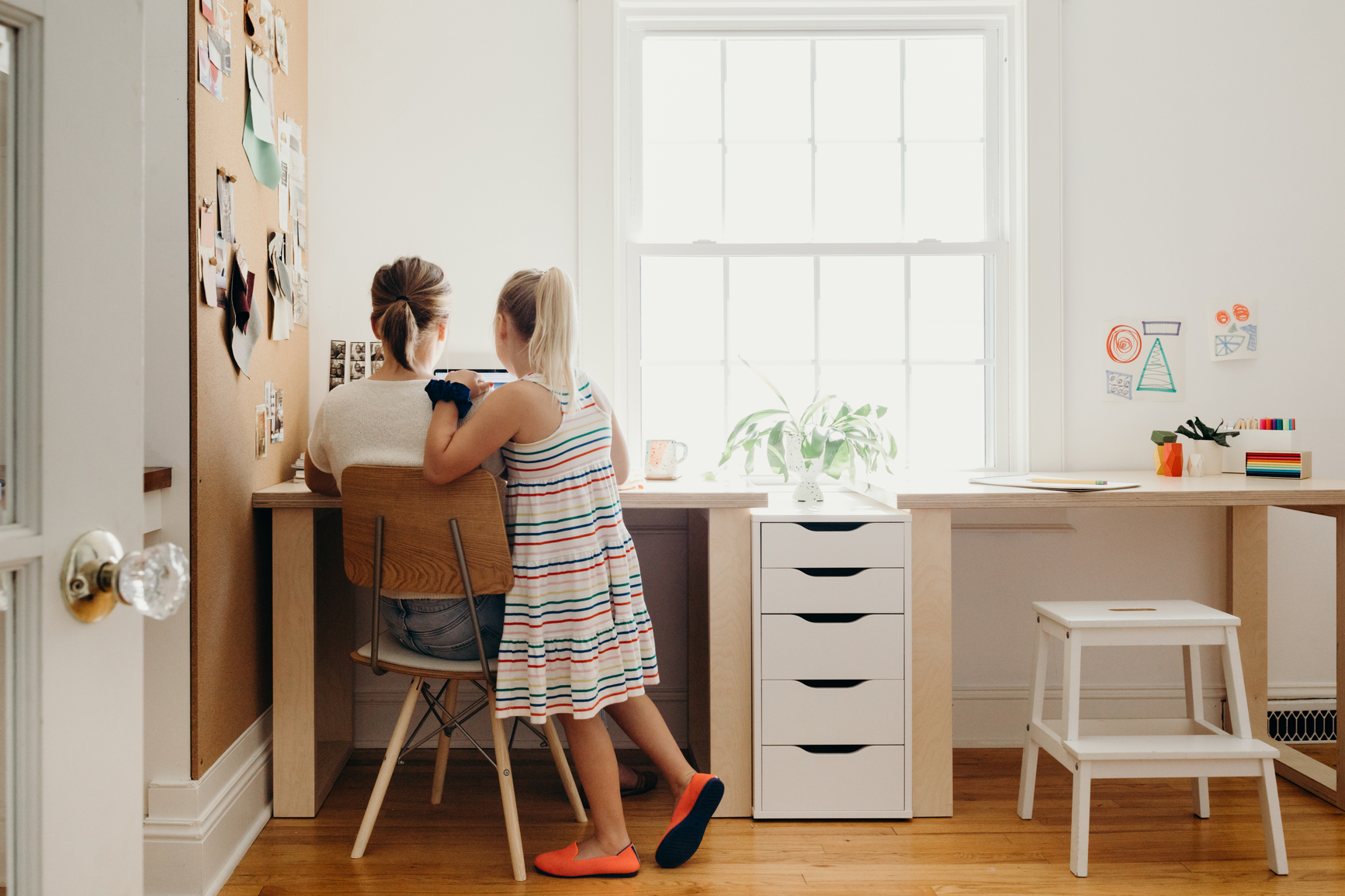 Mother and daughter at desk